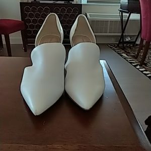 High heeled white leather shoes